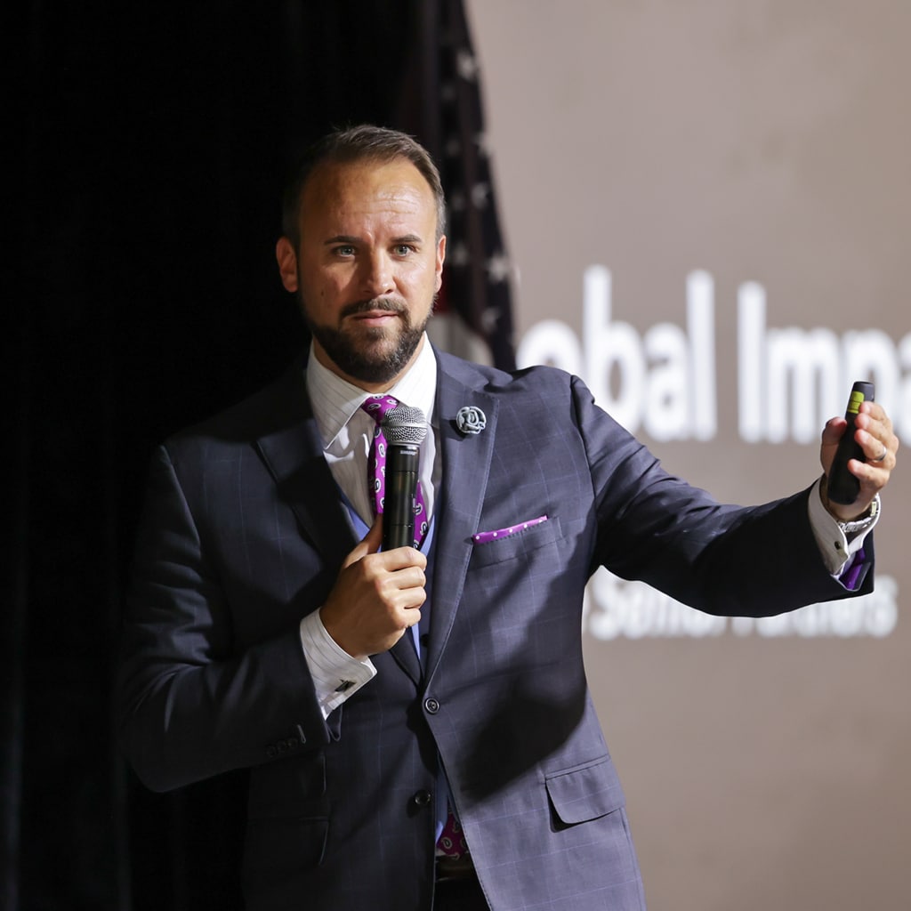 Dave Brown speaking on stage